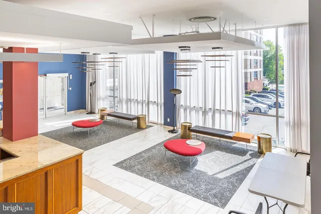 a living room with furniture and a table