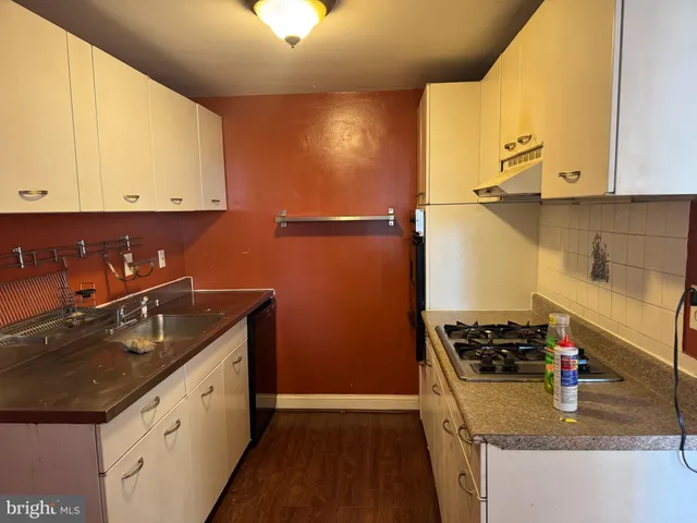 a kitchen that has a sink and a stove