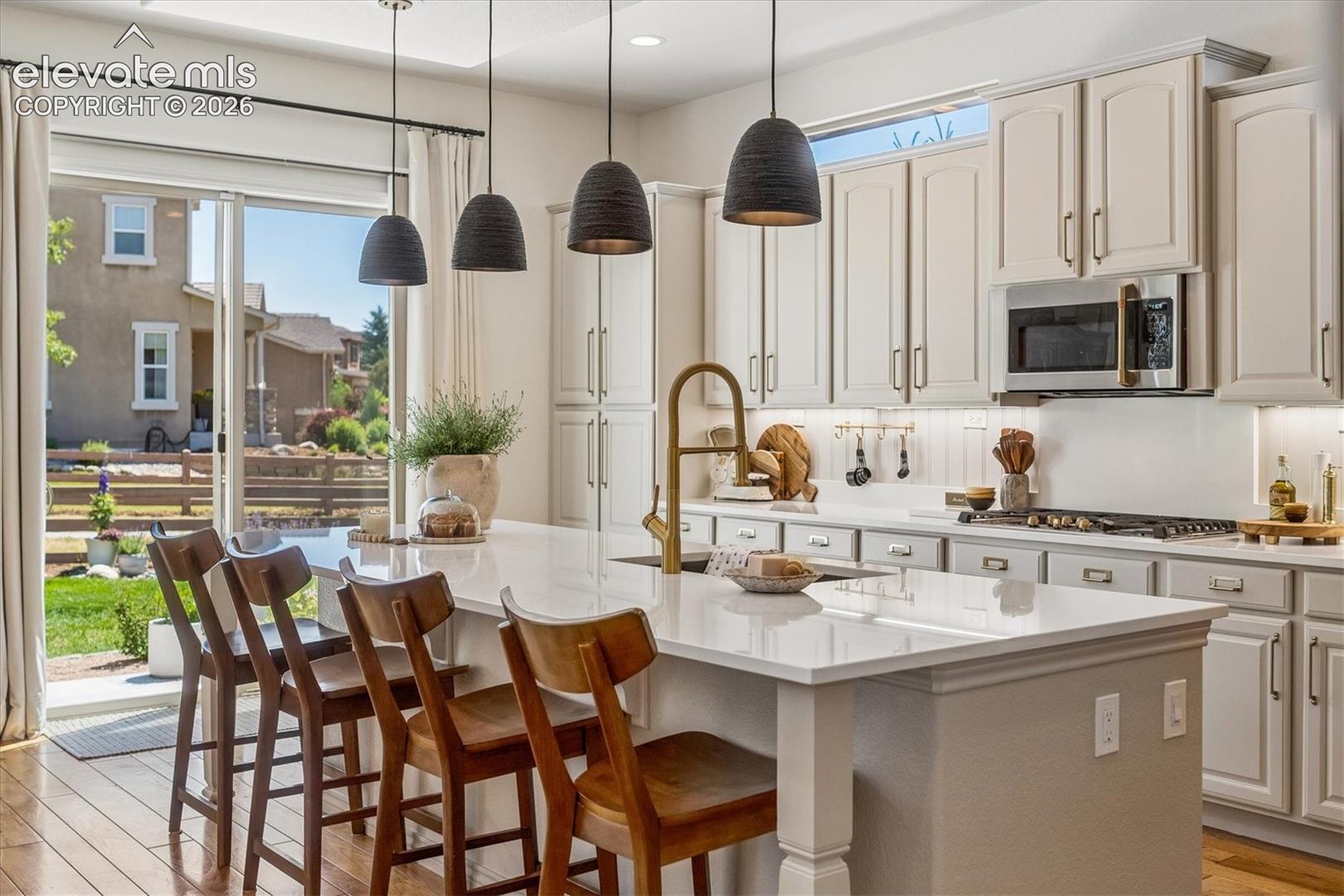 2388 Rusty Ridge Court Colorado Springs, CO 80921 - Photo 12 of 48 Gourmet kitchen featuring a large central island