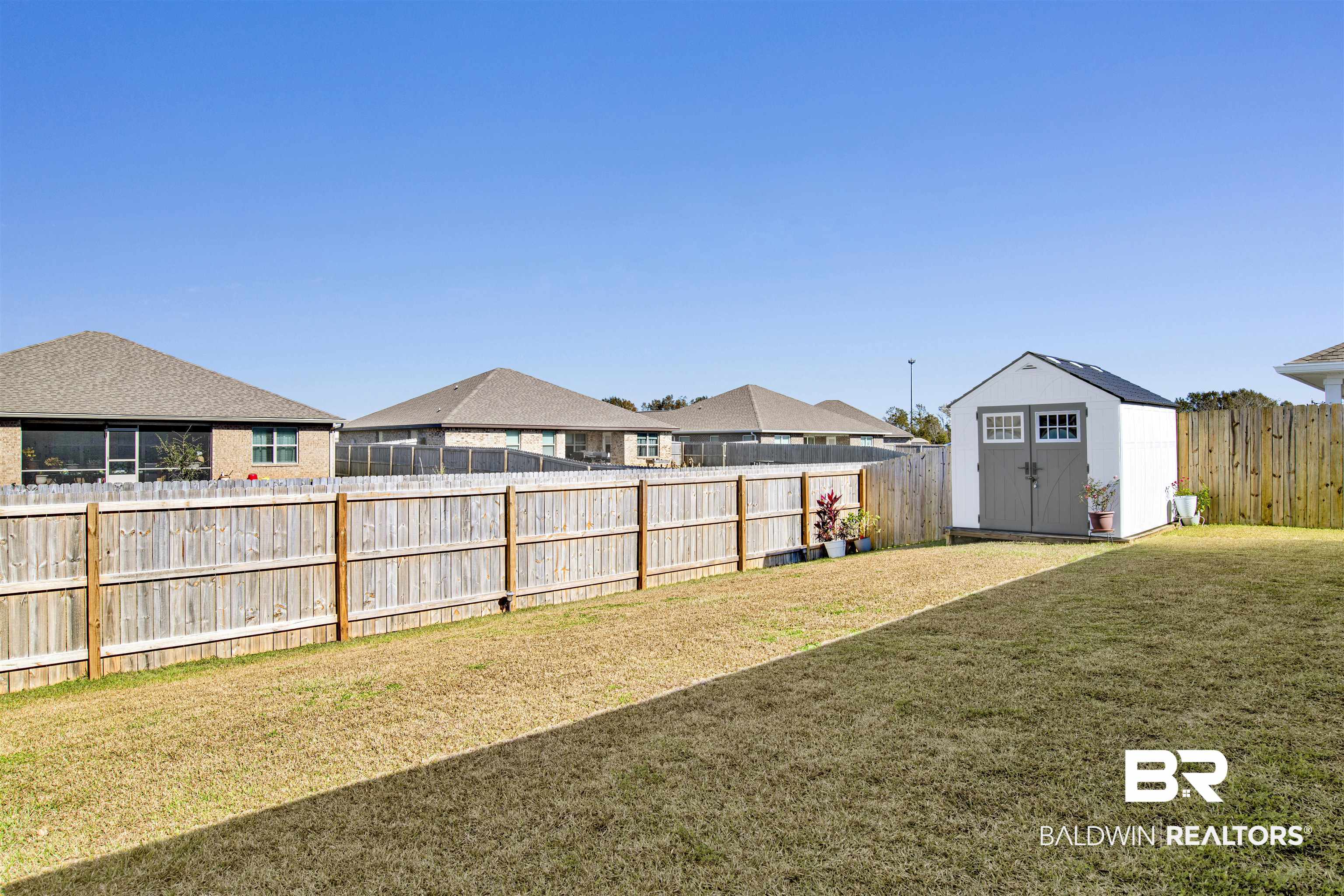 8102 Irwin Loop Daphne, AL 36526 - Photo 26 of 30 View of yard featuring a shed