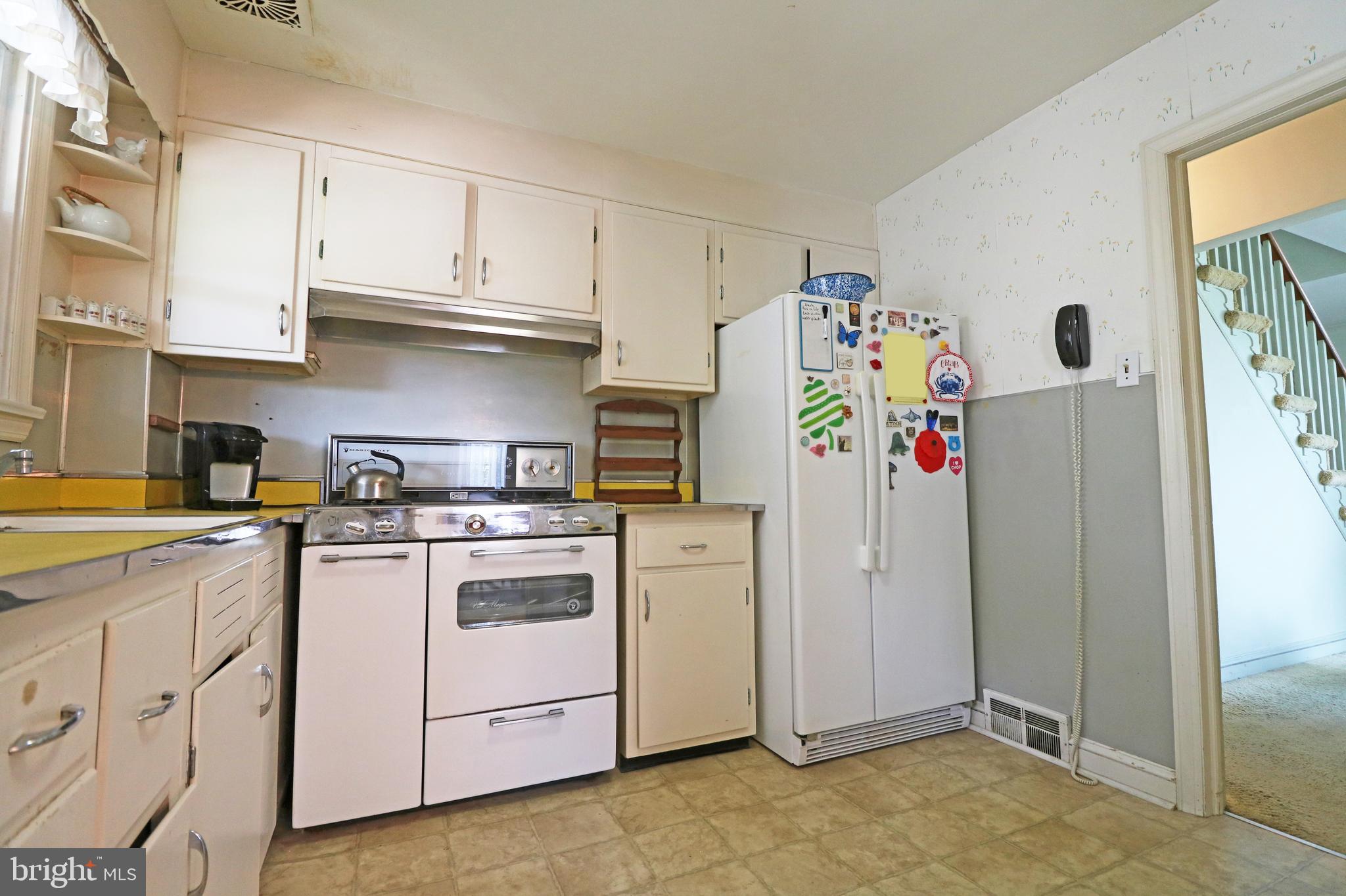 530 Hempstead Road Springfield, PA 19064 - Photo 11 of 36 a kitchen with stainless steel appliances granite countertop a refrigerator and a stove