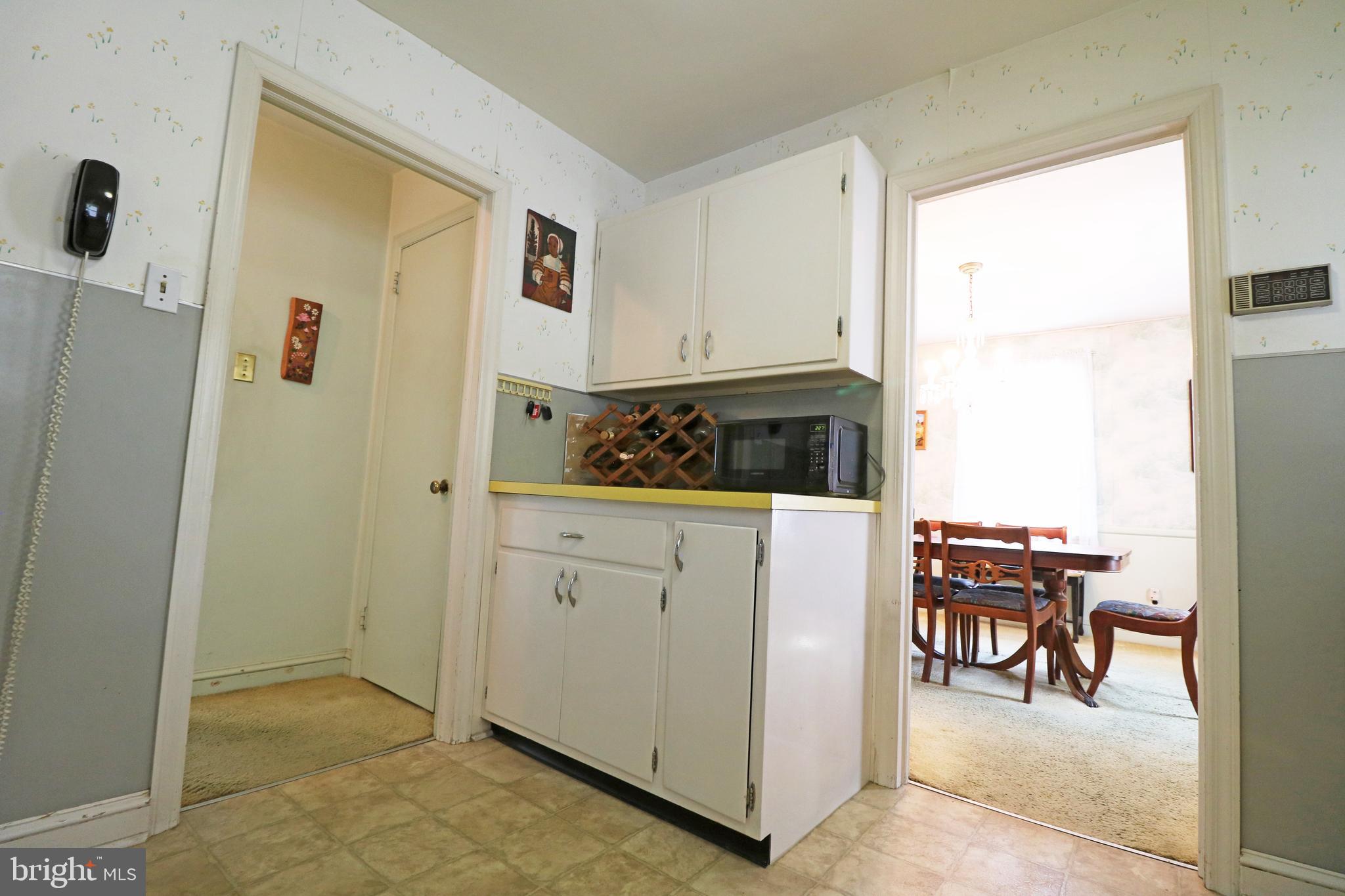 530 Hempstead Road Springfield, PA 19064 - Photo 12 of 36 a kitchen with stainless steel appliances granite countertop a refrigerator and a stove