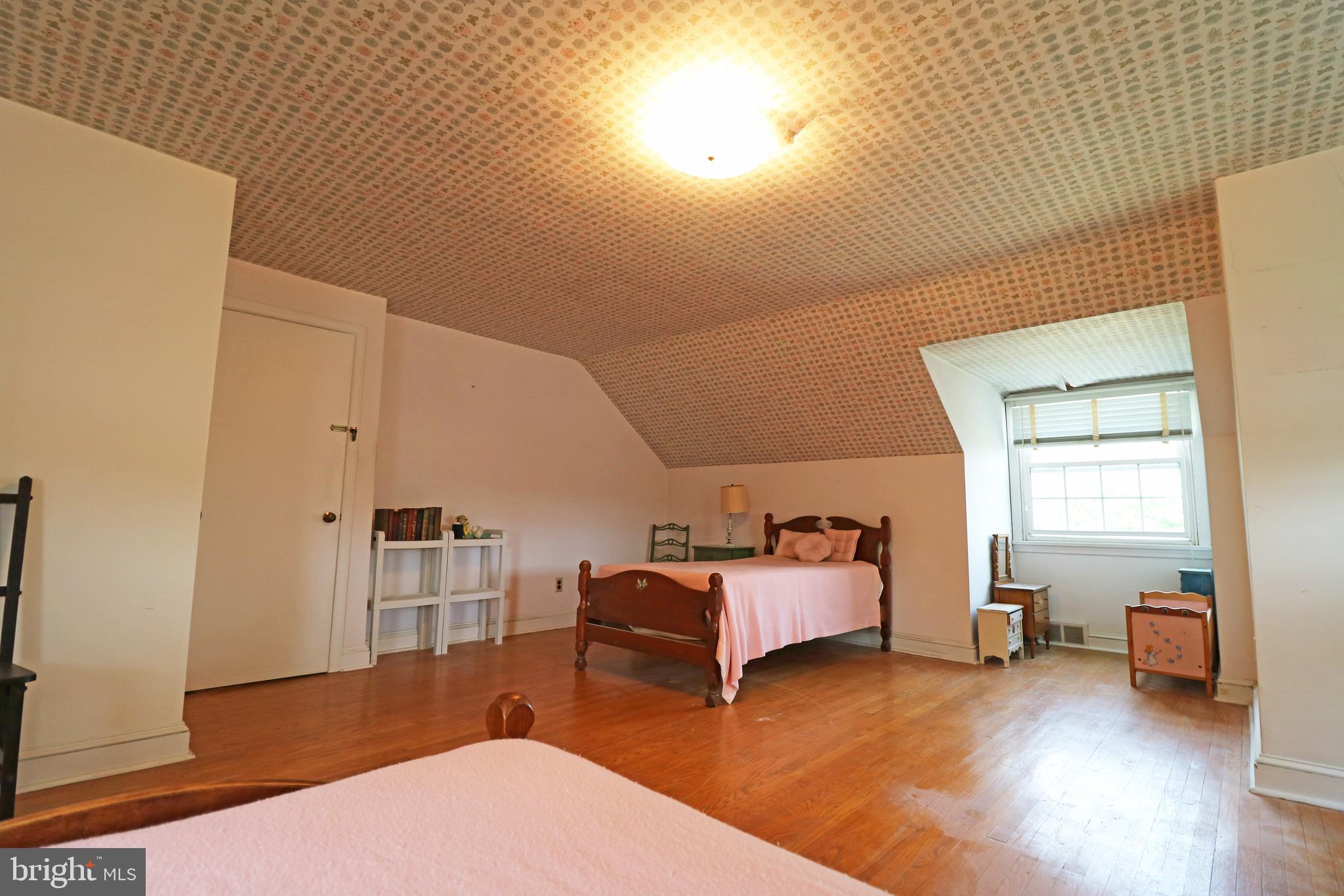 530 Hempstead Road Springfield, PA 19064 - Photo 19 of 36 a bedroom with furniture and a wooden floor