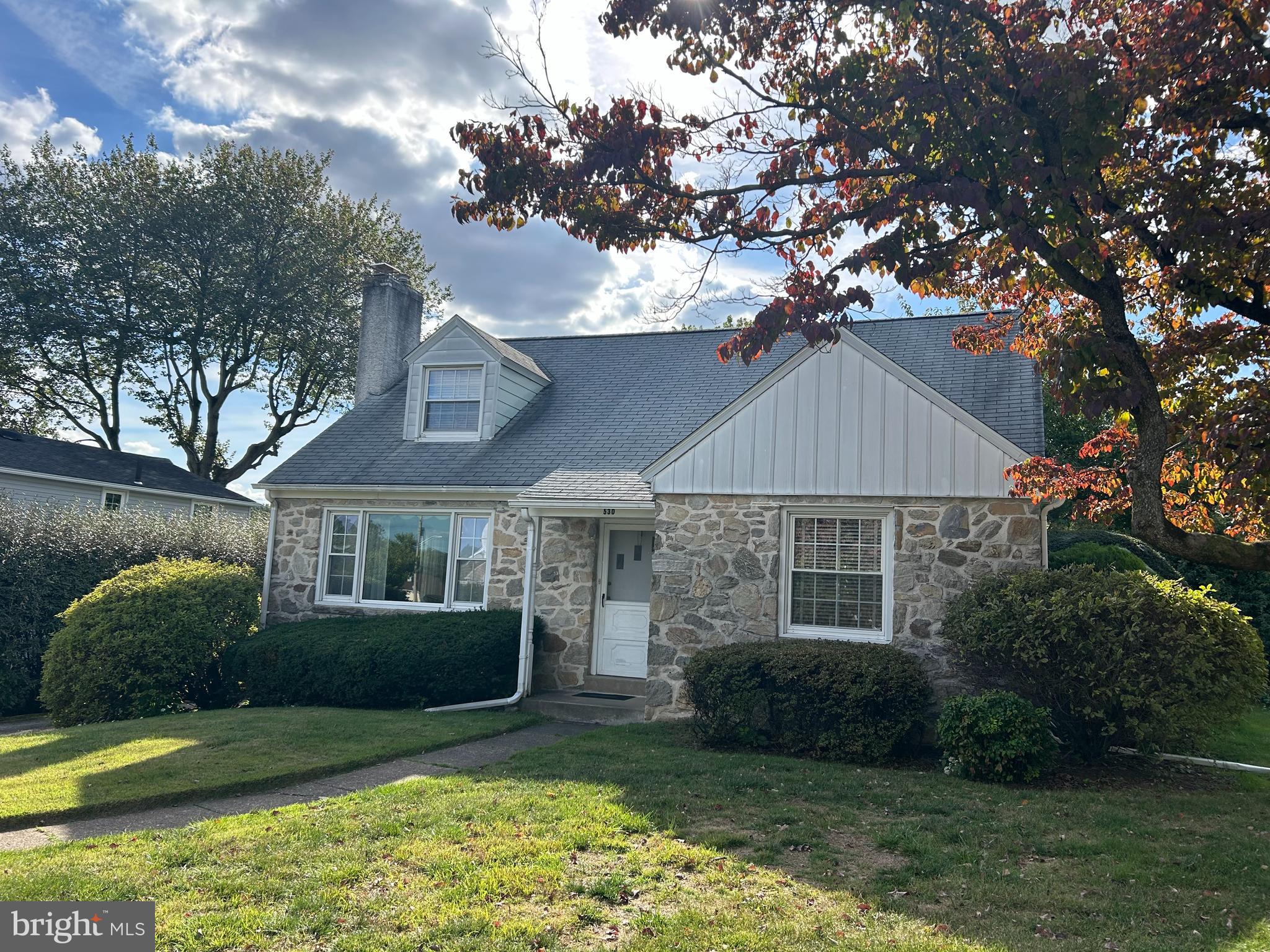 530 Hempstead Road Springfield, PA 19064 - Photo 2 of 36 a front view of a house with a yard and garage