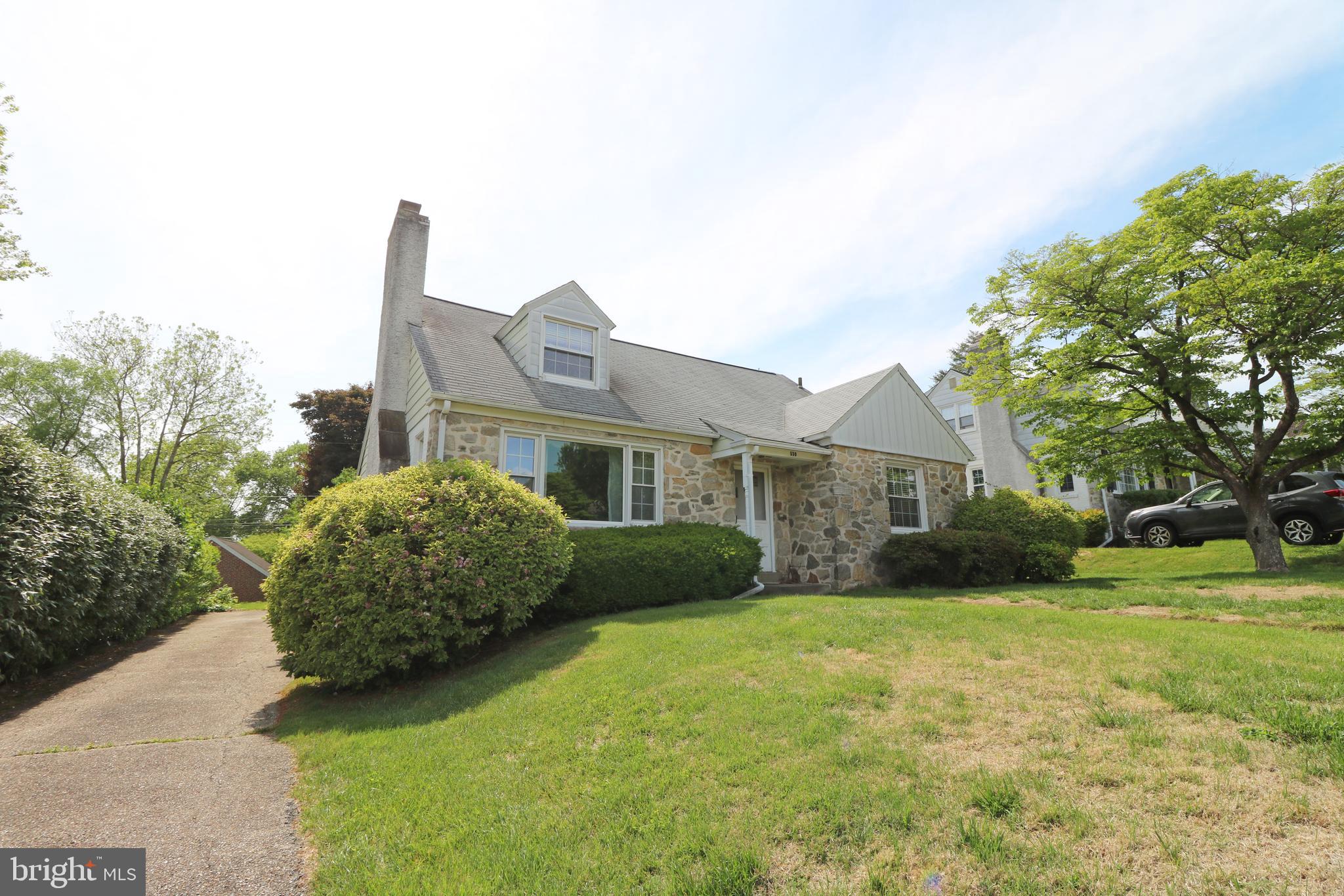 530 Hempstead Road Springfield, PA 19064 - Photo 3 of 36 a front view of a house with a garden and plants