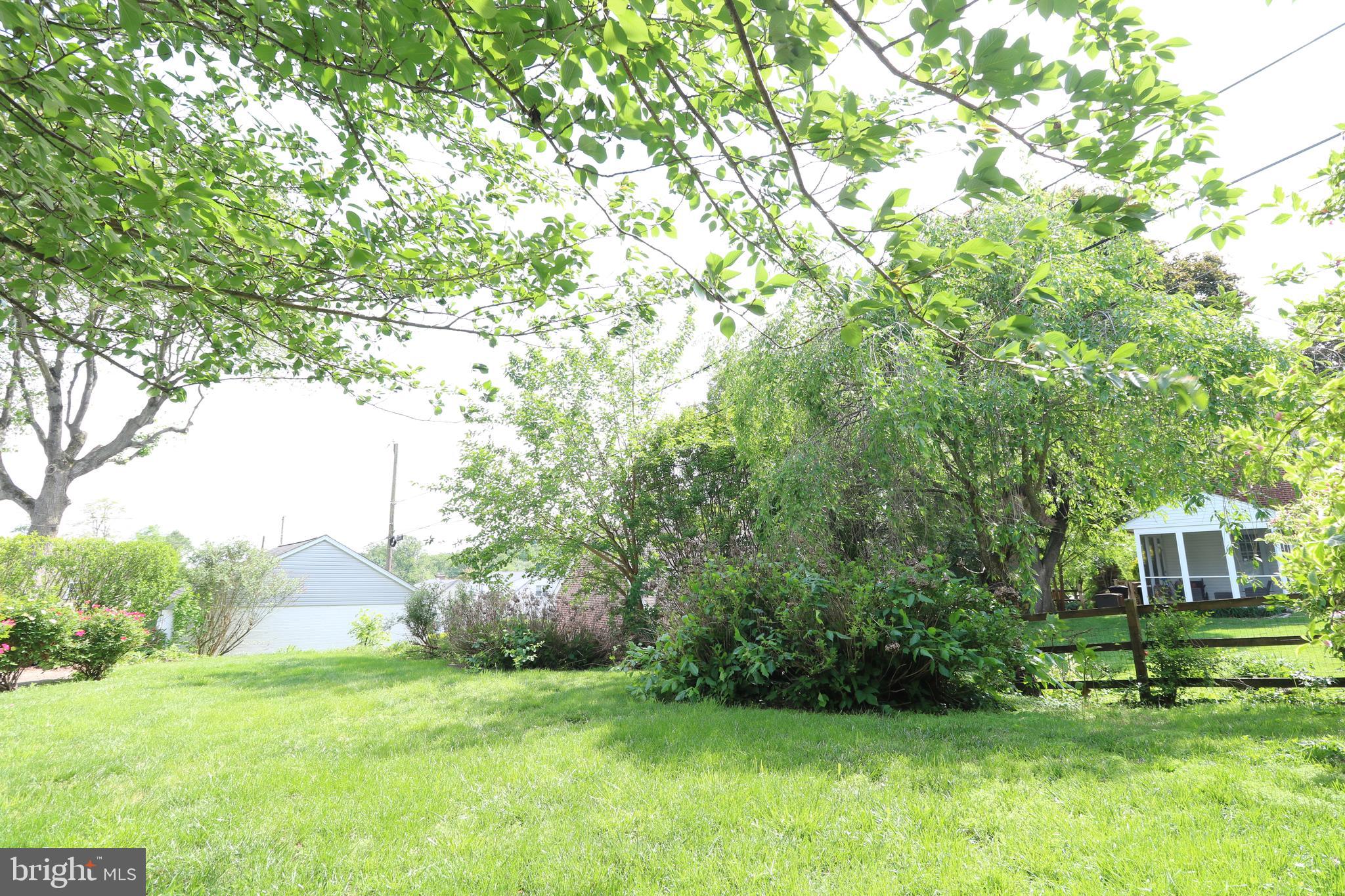 530 Hempstead Road Springfield, PA 19064 - Photo 32 of 36 a view of a big house with a big yard and large trees