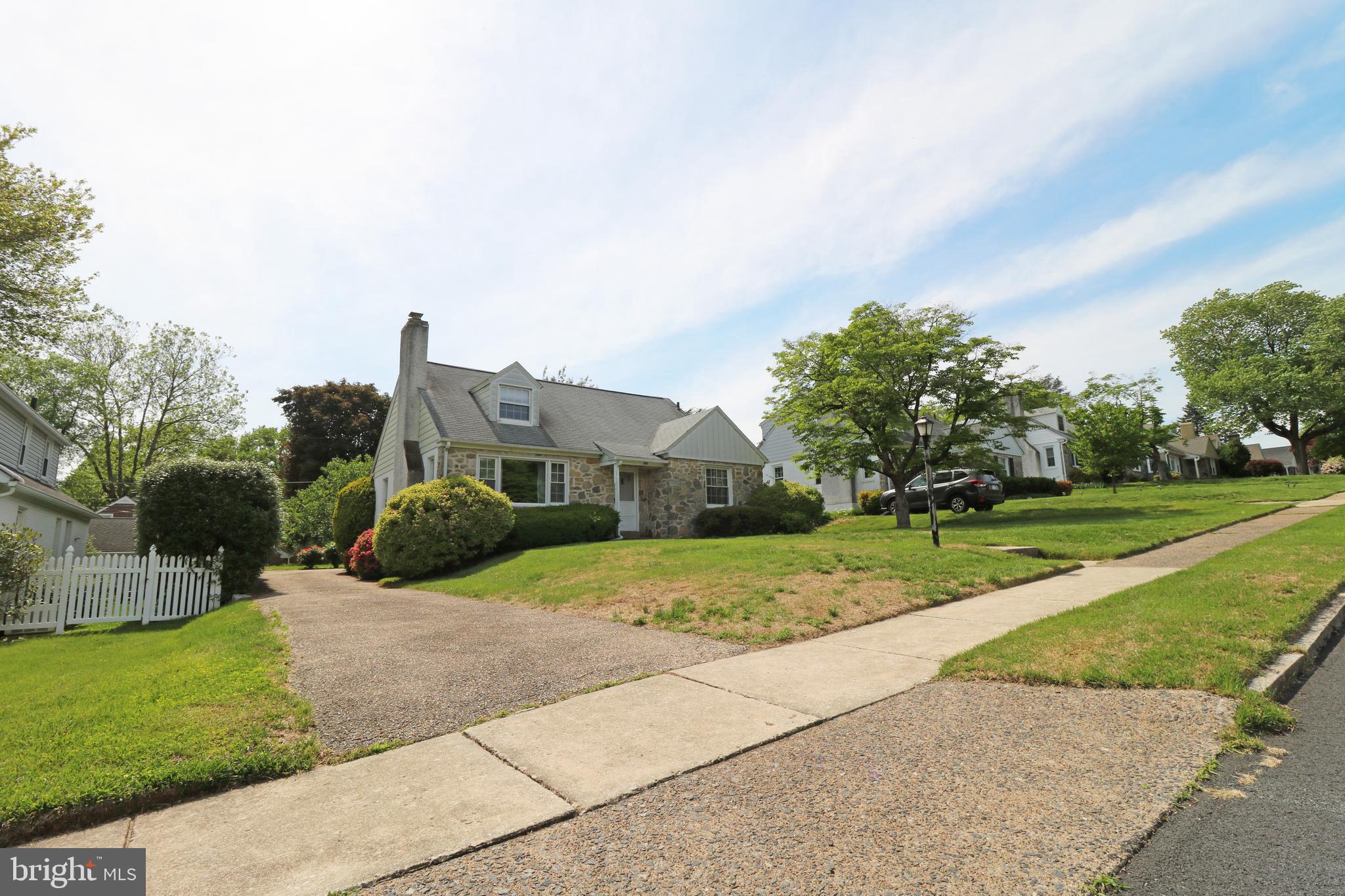 530 Hempstead Road Springfield, PA 19064 - Photo 5 of 36 a view of a house with a big yard plants and large trees
