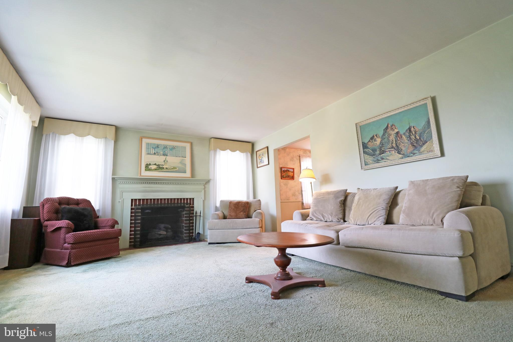 530 Hempstead Road Springfield, PA 19064 - Photo 7 of 36 a living room with furniture and a fireplace
