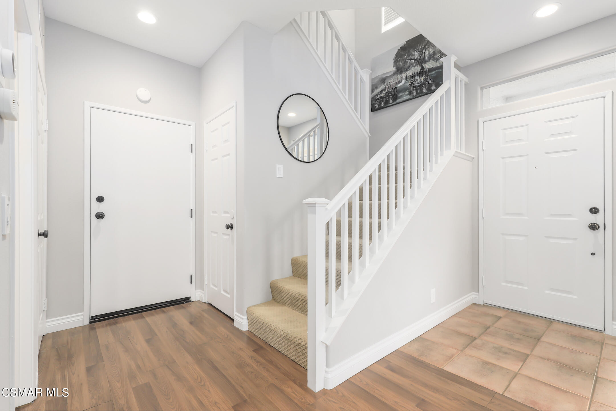 4006 Brindisi Place Moorpark, CA 93021 - Photo 12 of 32 a view of a hallway with wooden floor and entryway