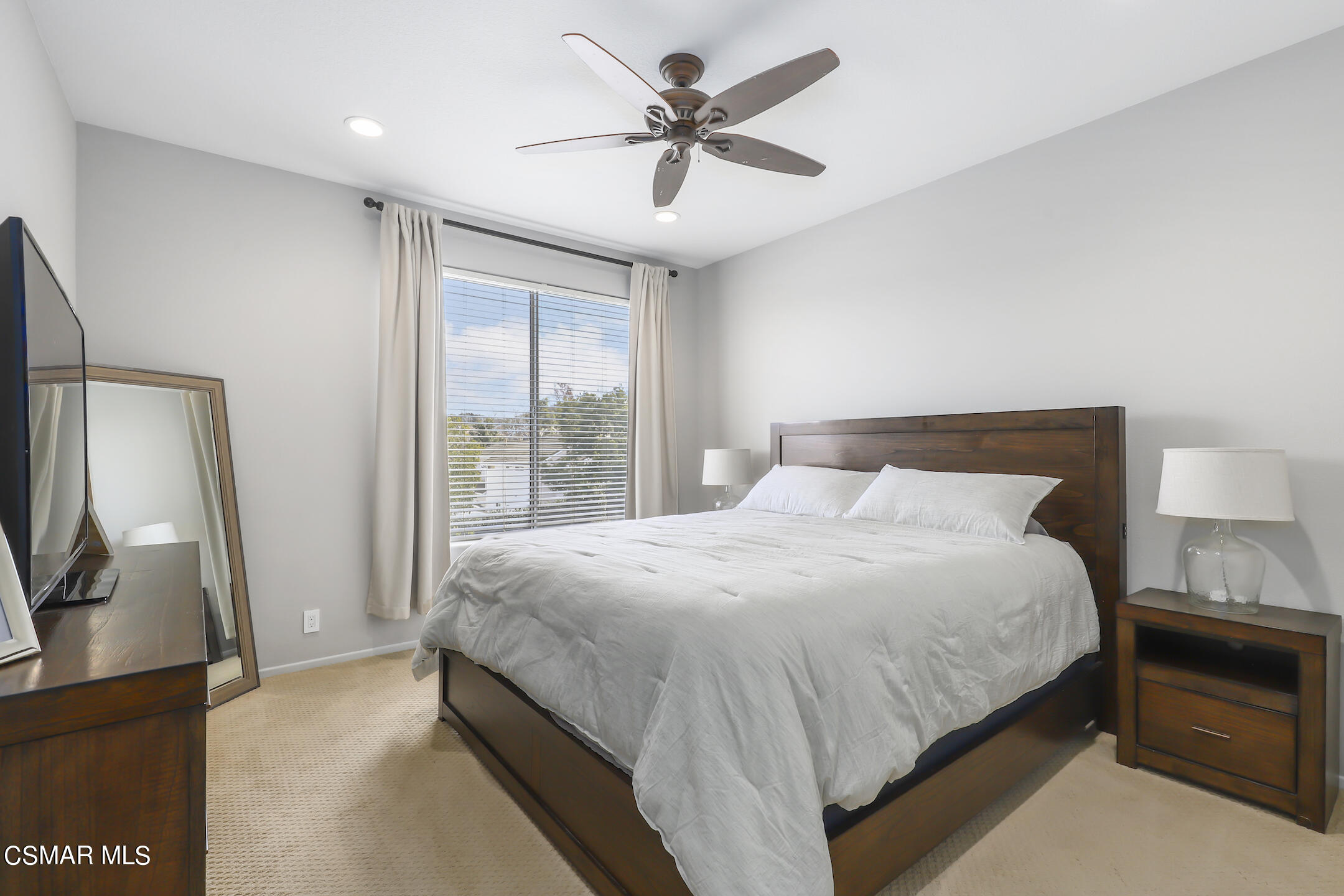 4006 Brindisi Place Moorpark, CA 93021 - Photo 15 of 32 a bedroom with a bed a window and a flat screen television