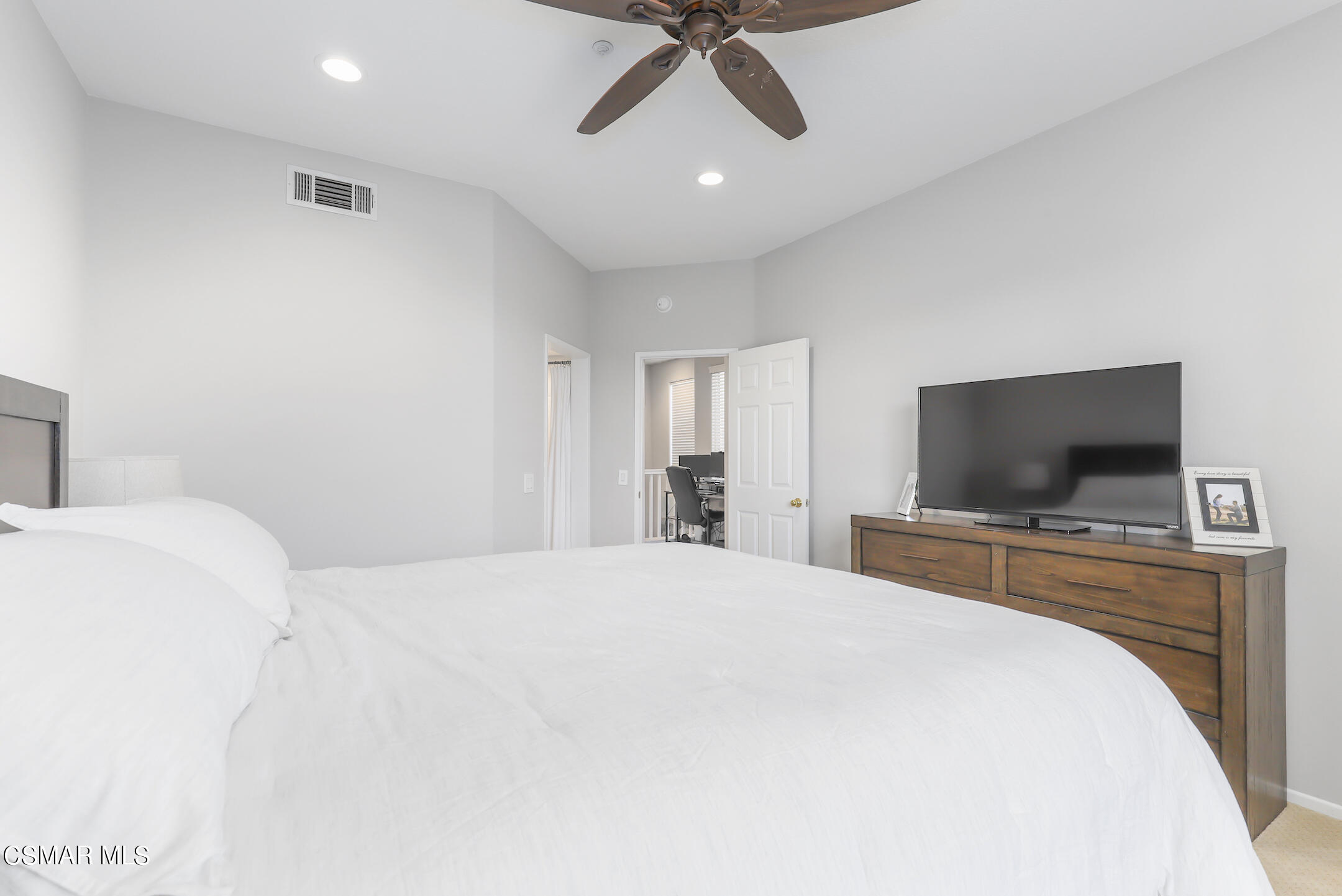 4006 Brindisi Place Moorpark, CA 93021 - Photo 16 of 32 a bedroom with a bed and a flat screen tv