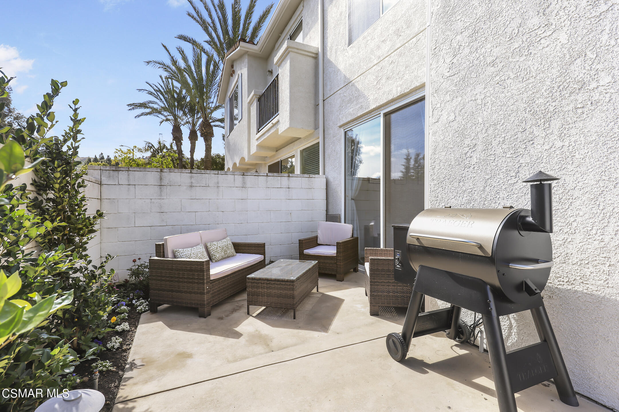 4006 Brindisi Place Moorpark, CA 93021 - Photo 24 of 32 a view of a patio with couple of chairs and a potted plant