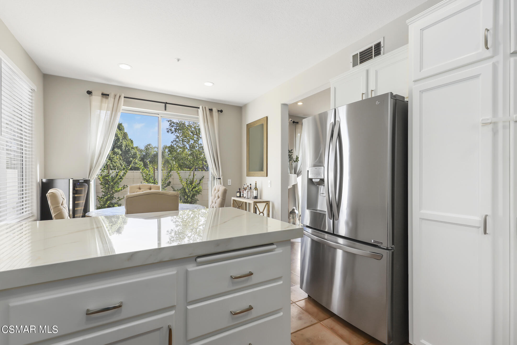 4006 Brindisi Place Moorpark, CA 93021 - Photo 6 of 32 a kitchen with appliances a refrigerator and window