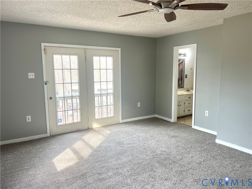 2049 Riddle Road Blackstone, VA 23824 - Photo 13 of 44 Unfurnished bedroom featuring light carpet, a text