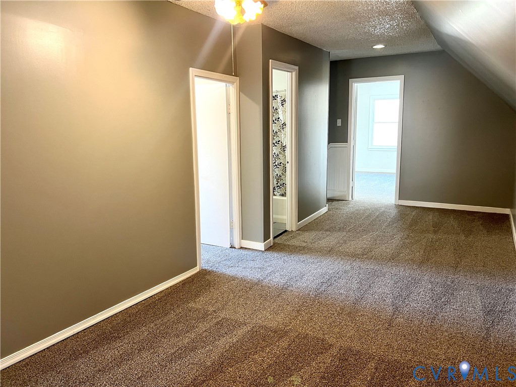 2049 Riddle Road Blackstone, VA 23824 - Photo 30 of 44 Bonus room featuring a textured ceiling and light