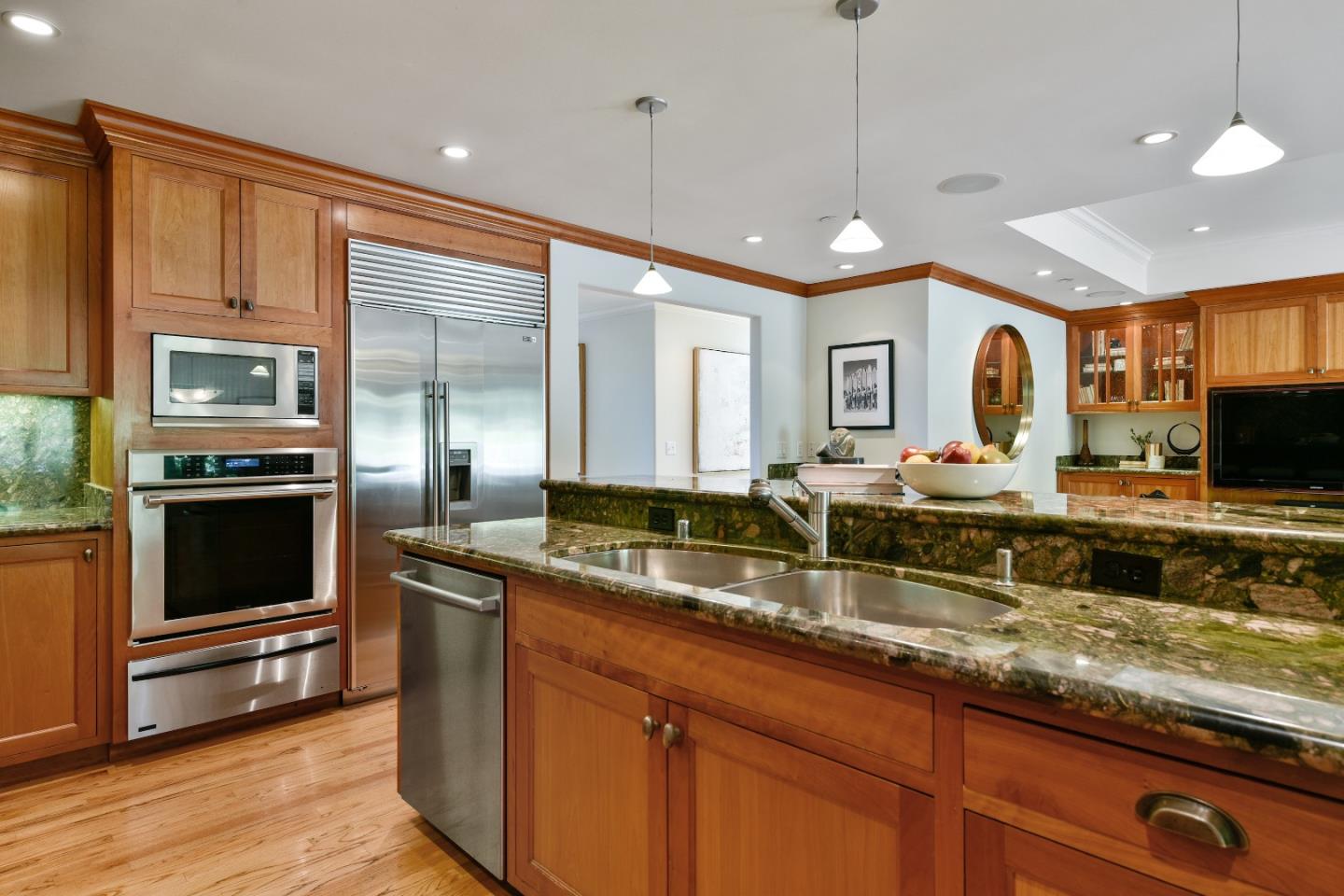 855 Longview Road Hillsborough, CA 94010 - Photo 11 of 32 a kitchen with granite countertop stainless steel appliances a stove sink and cabinets