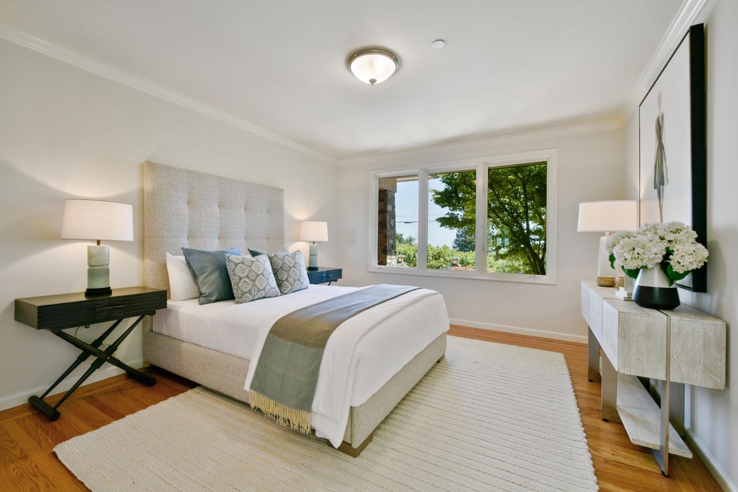 855 Longview Road Hillsborough, CA 94010 - Photo 13 of 32 a bed room with a bed and a potted plant