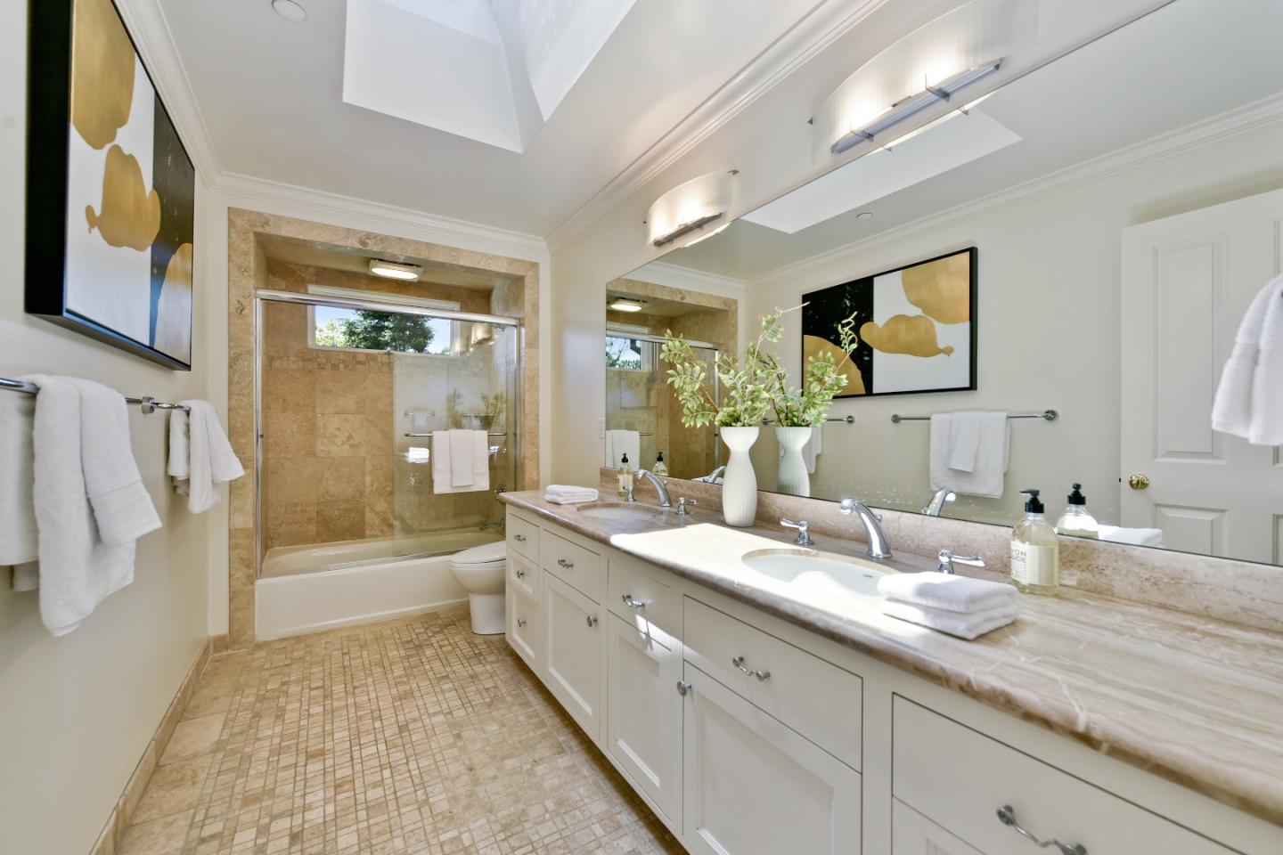 855 Longview Road Hillsborough, CA 94010 - Photo 16 of 32 a bathroom with a double vanity sink a mirror and a shower