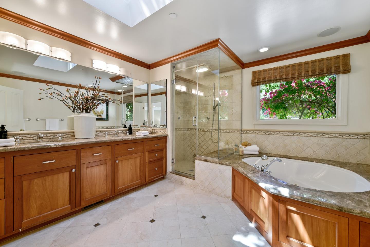 855 Longview Road Hillsborough, CA 94010 - Photo 20 of 32 a spacious bathroom with a granite countertop tub sink shower and mirror