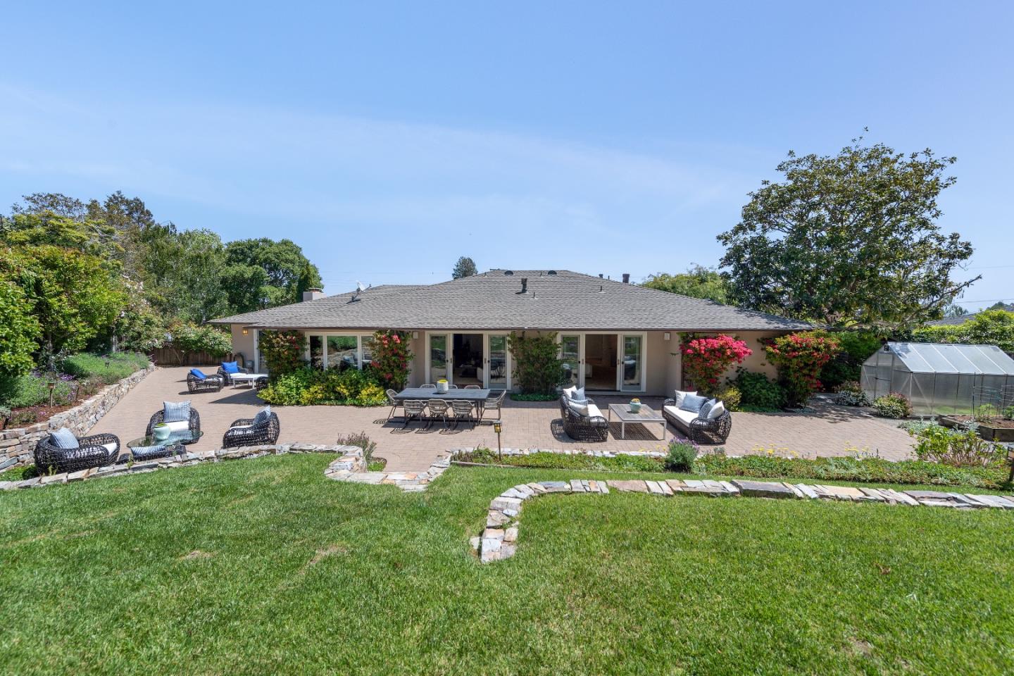 855 Longview Road Hillsborough, CA 94010 - Photo 23 of 32 a view of a house with backyard sitting area and garden