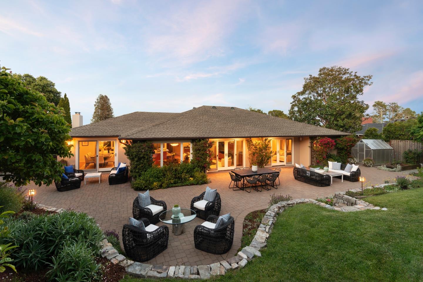855 Longview Road Hillsborough, CA 94010 - Photo 27 of 32 a view of a patio with couches and chairs under an umbrella