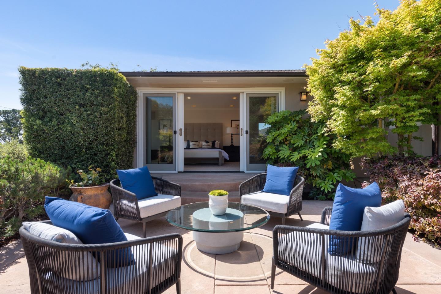 855 Longview Road Hillsborough, CA 94010 - Photo 28 of 32 a view of a patio with couches chairs and a potted plant