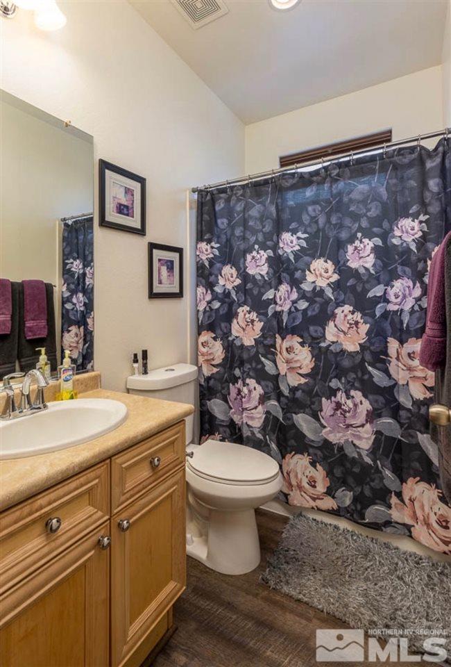 9150 Sunrock Road Reno, NV 89521 - Photo 11 of 19 a bathroom with a sink toilet and a mirror