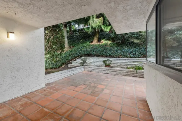 a view of two chairs in balcony
