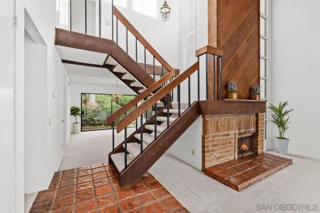 a view of entryway with wooden floor and a rug