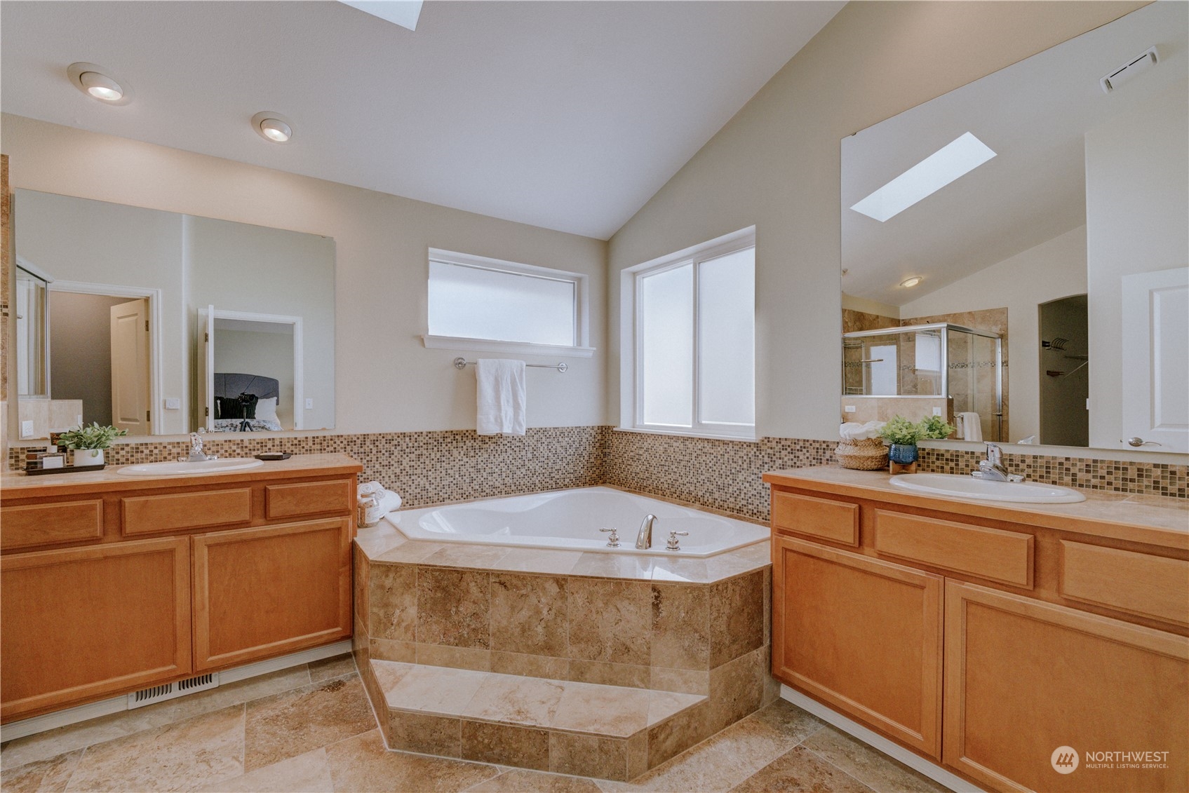 2115 241st Street Southwest Bothell, WA 98021 - Photo 25 of 40 a spacious bathroom with a granite countertop sink and a mirror