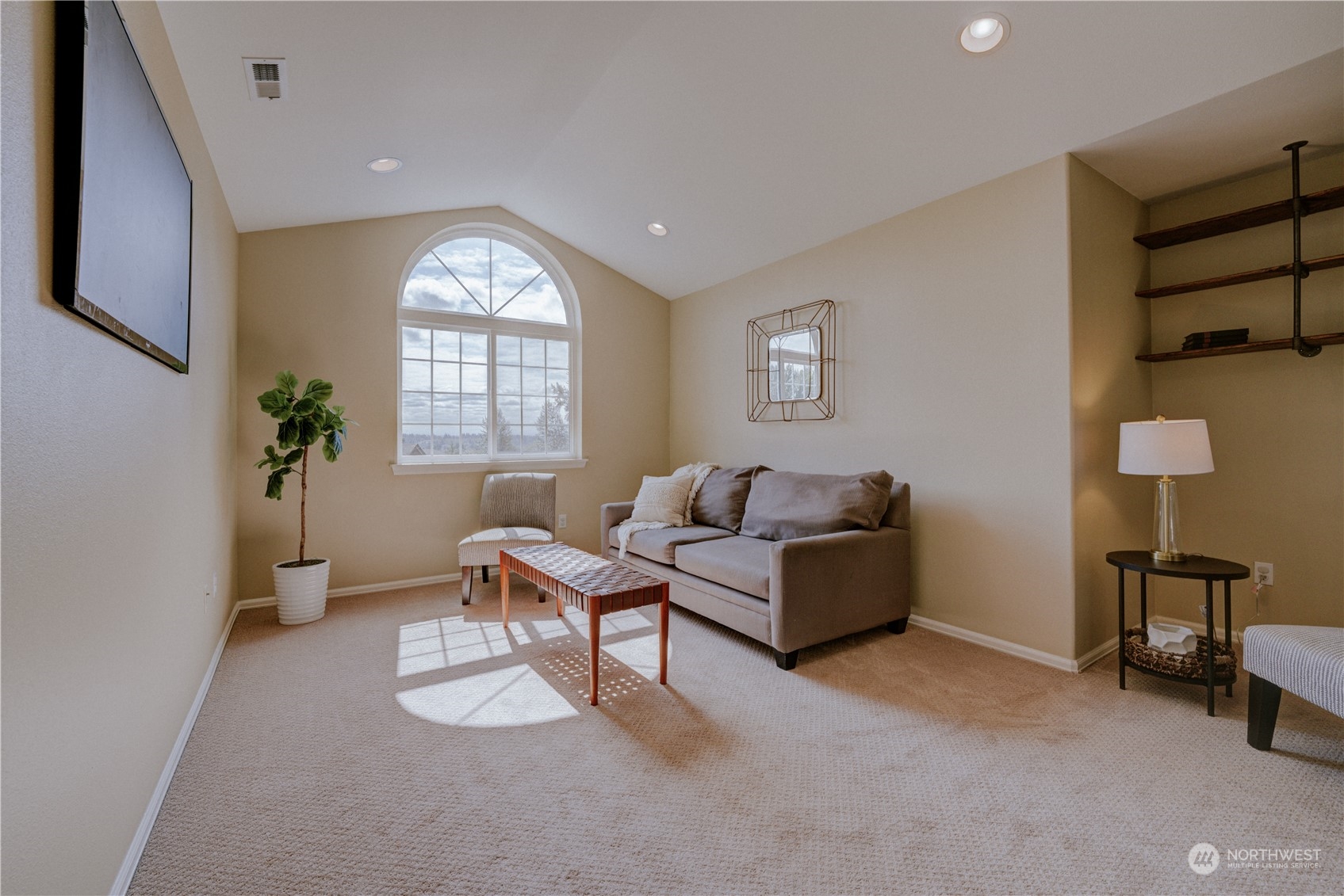 2115 241st Street Southwest Bothell, WA 98021 - Photo 31 of 40 a living room with furniture and a window