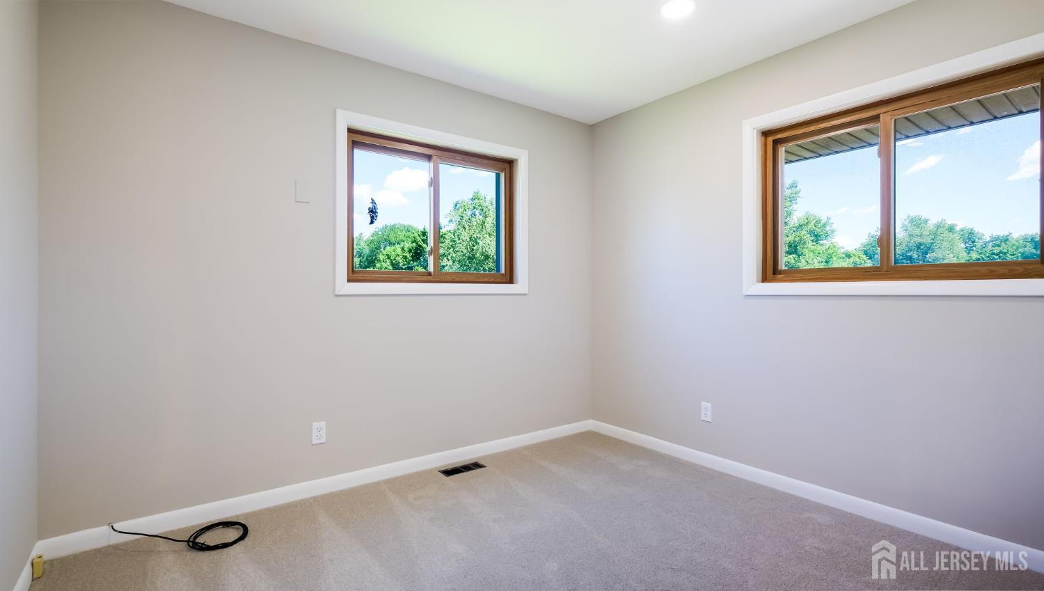 50 Sand Hills Road Kendall Park, NJ 08824 - Photo 20 of 27 an empty room with a window