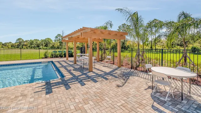 a view of swimming pool with a lake view