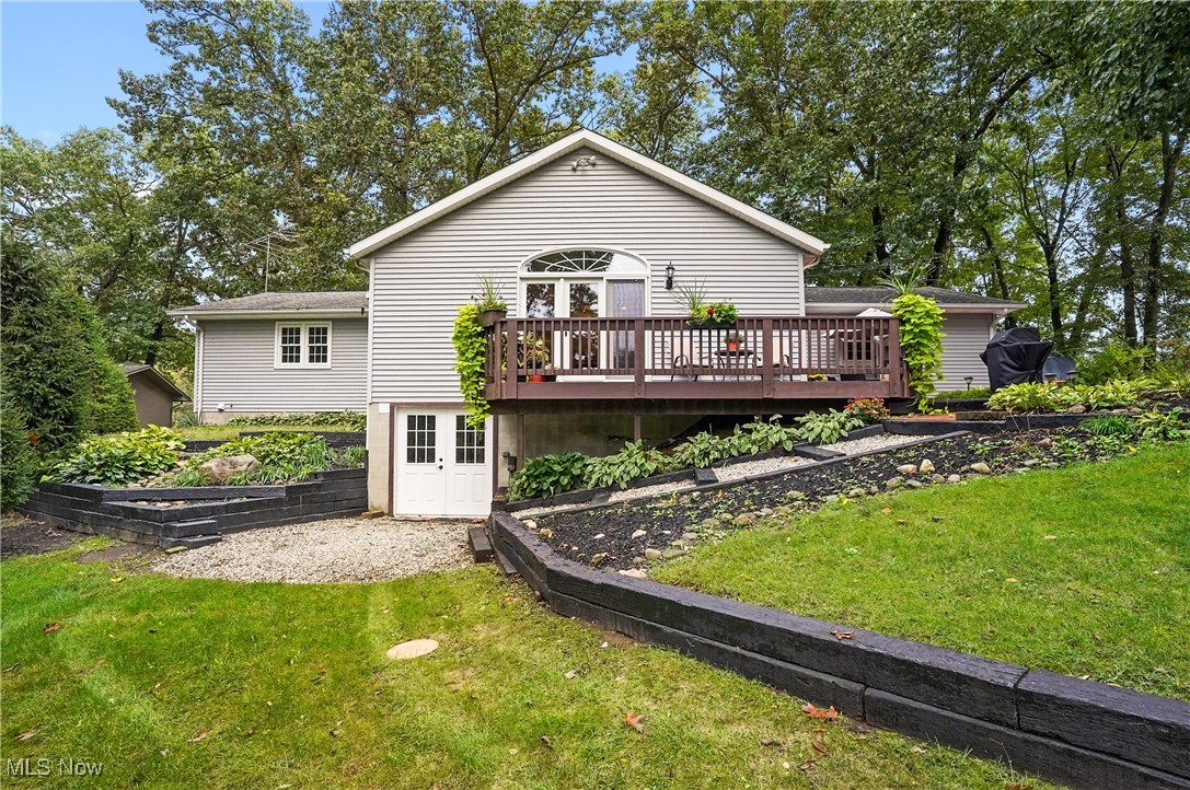 449 East Comet Road Clinton, OH 44216 - Photo 11 of 39 Rear view of property with a deck and a lawn