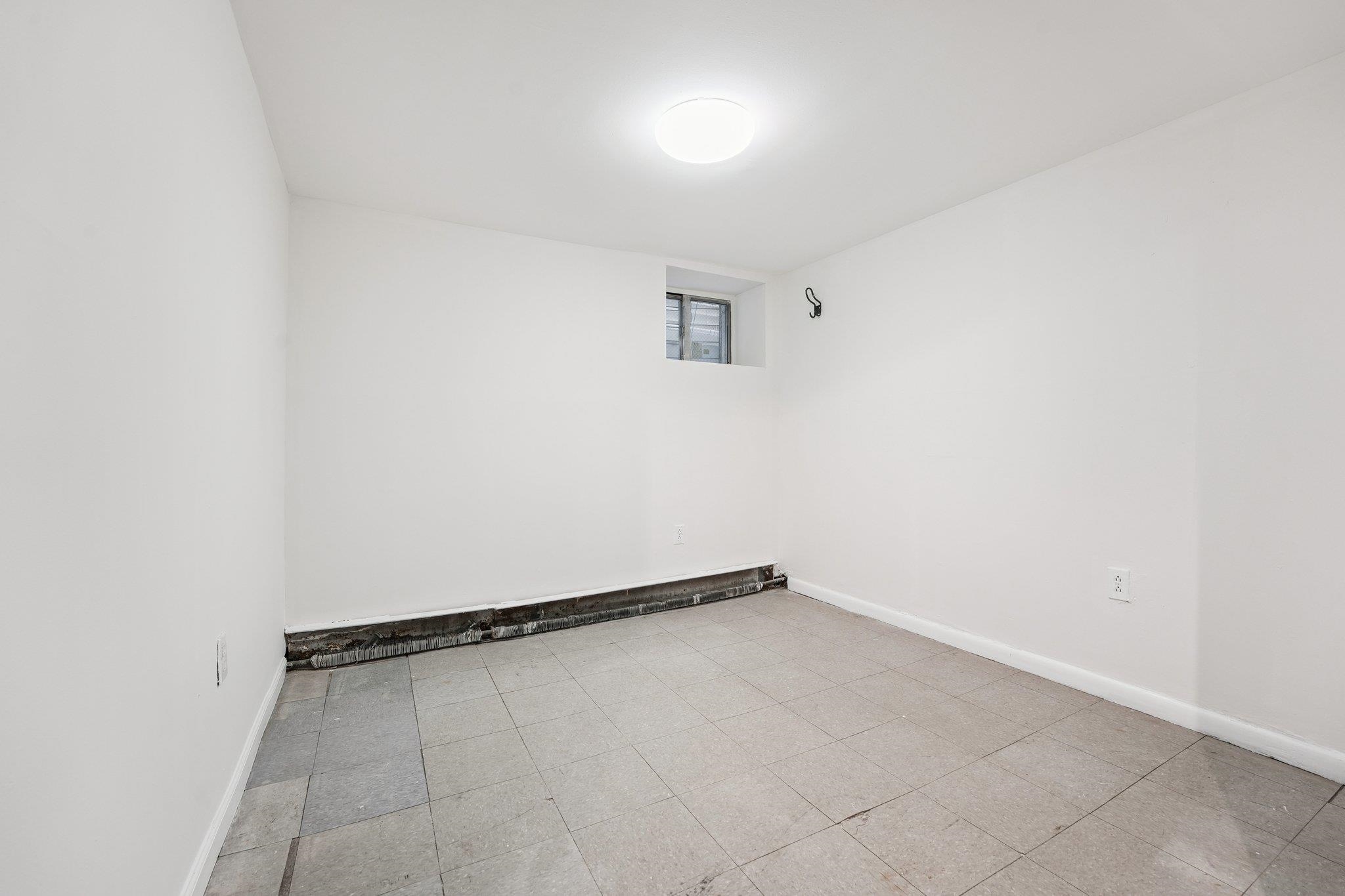 910 19th Street Union City, NJ 07087 - Photo 12 of 30 a view of an empty room