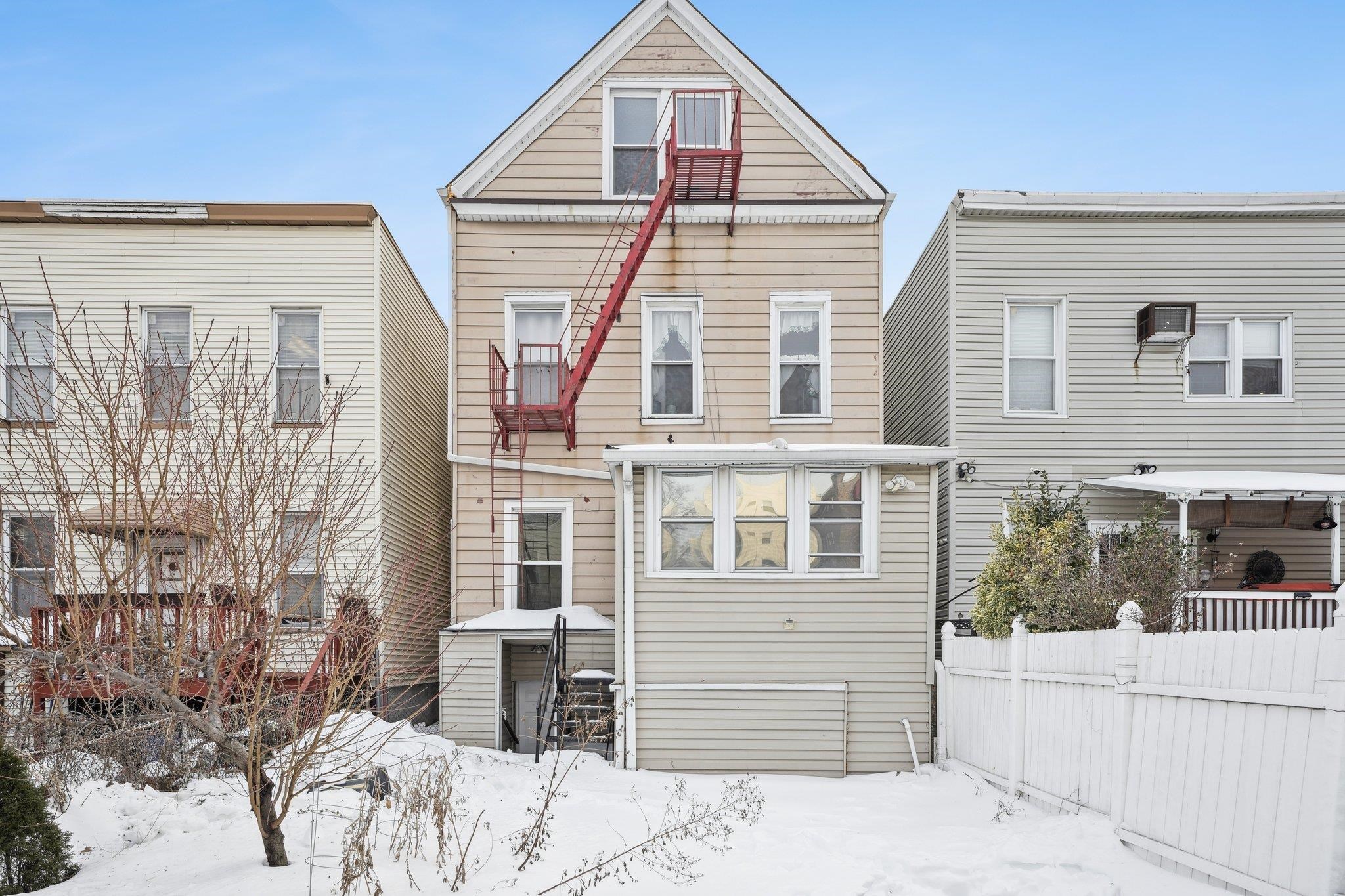 910 19th Street Union City, NJ 07087 - Photo 28 of 30 a view of a house with a yard