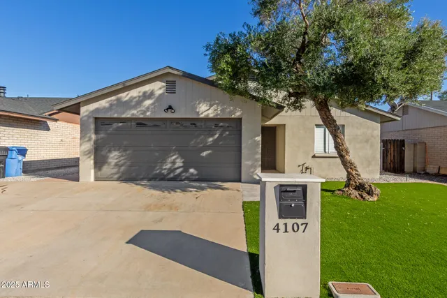 a view of a house with a back yard