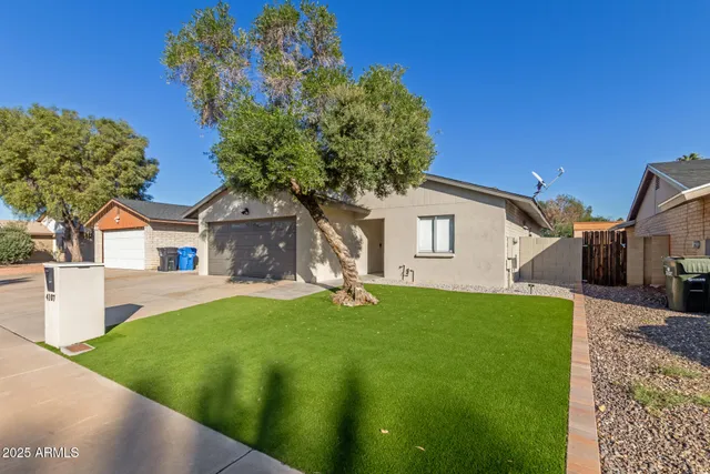 a house that has a tree in front of it