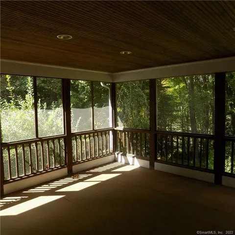 a view of balcony with green space