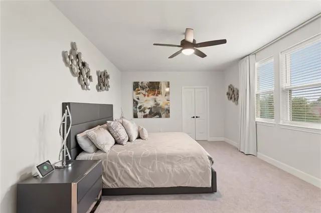 a view of a livingroom with furniture and white walls