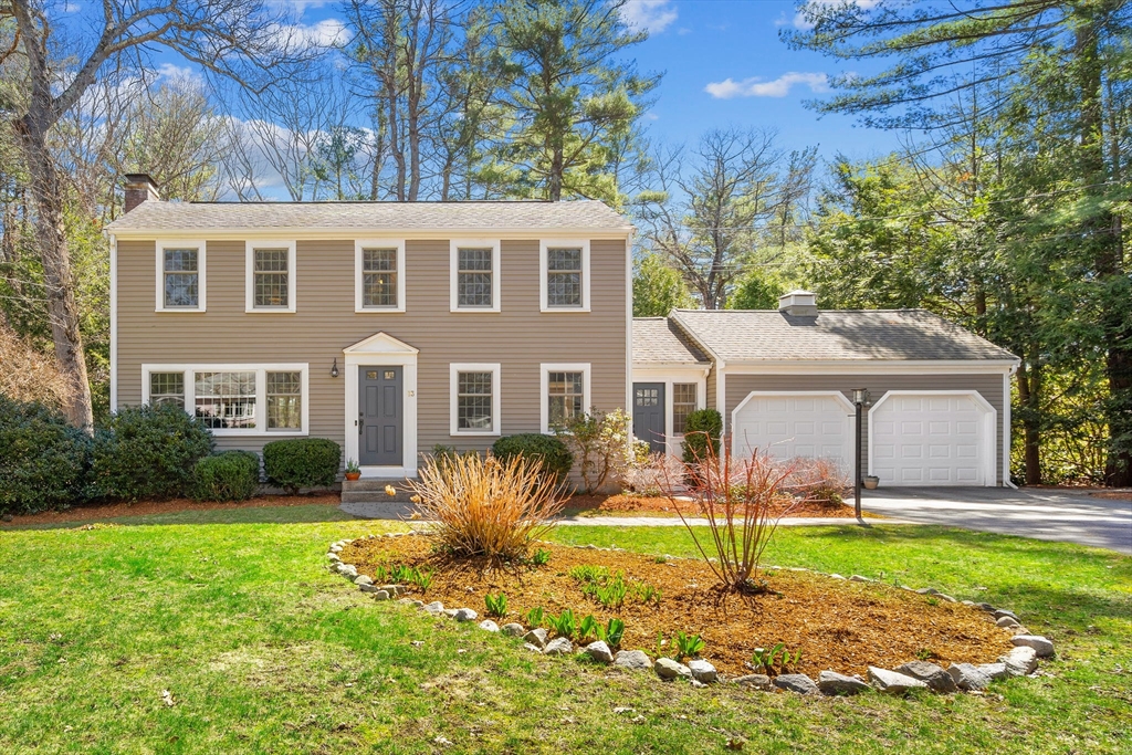 13 Mohegan Road Acton, MA 01720 - Photo 1 of 39 a backyard of a house with yard and outdoor seating