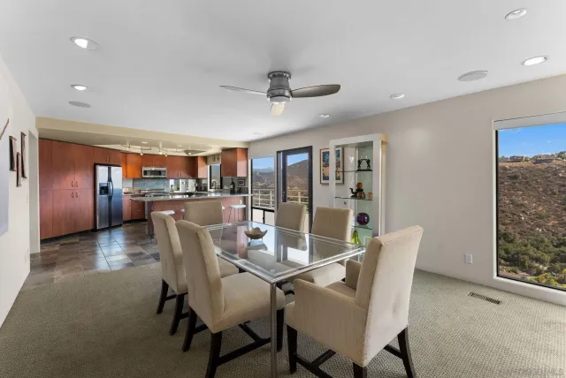 a dining room with furniture and window