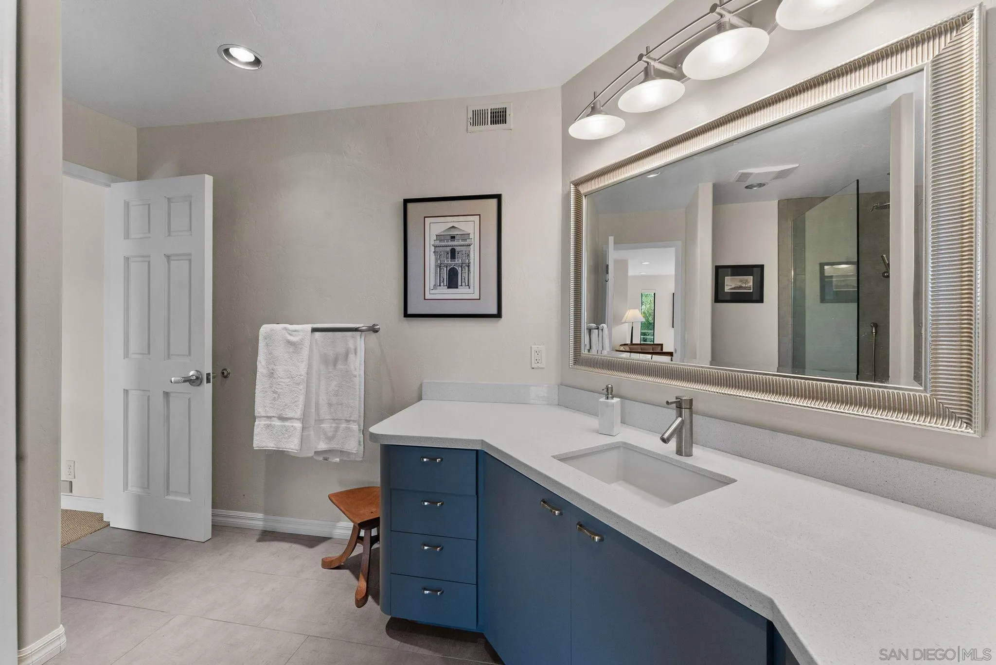 2552 Singing Vista Way El Cajon, CA 92019 - Photo 19 of 34 a en suite bathroom with a double vanity sink and a mirror