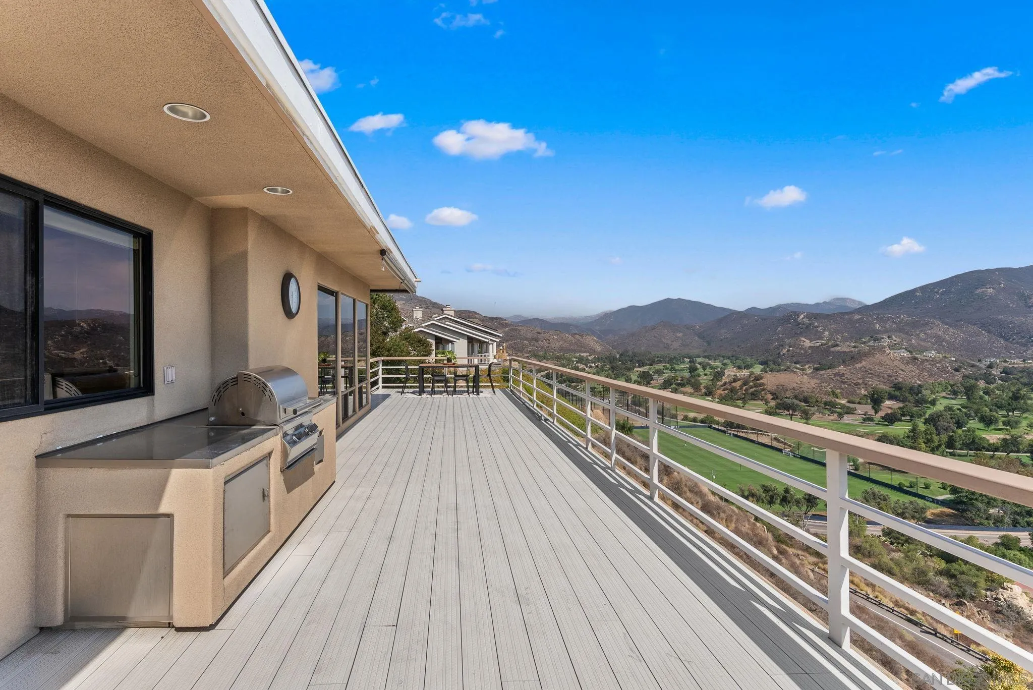 2552 Singing Vista Way El Cajon, CA 92019 - Photo 27 of 34 a view of a balcony with wooden floor and iron stairs