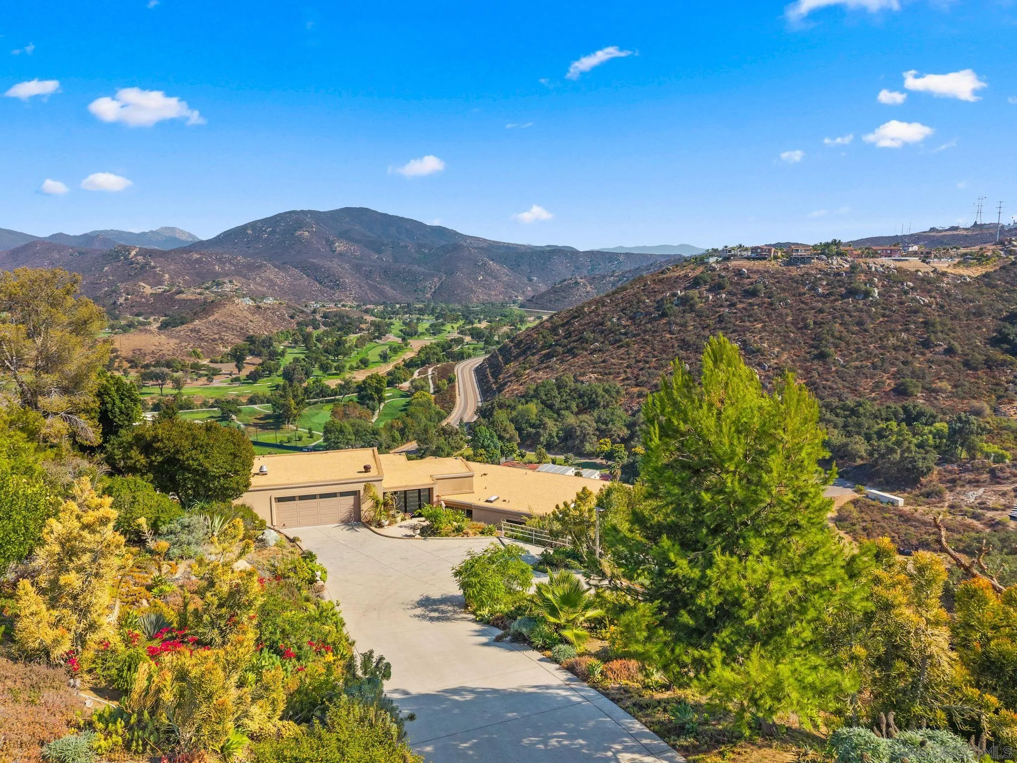 2552 Singing Vista Way El Cajon, CA 92019 - Photo 4 of 34 a view of a city with mountains in the background