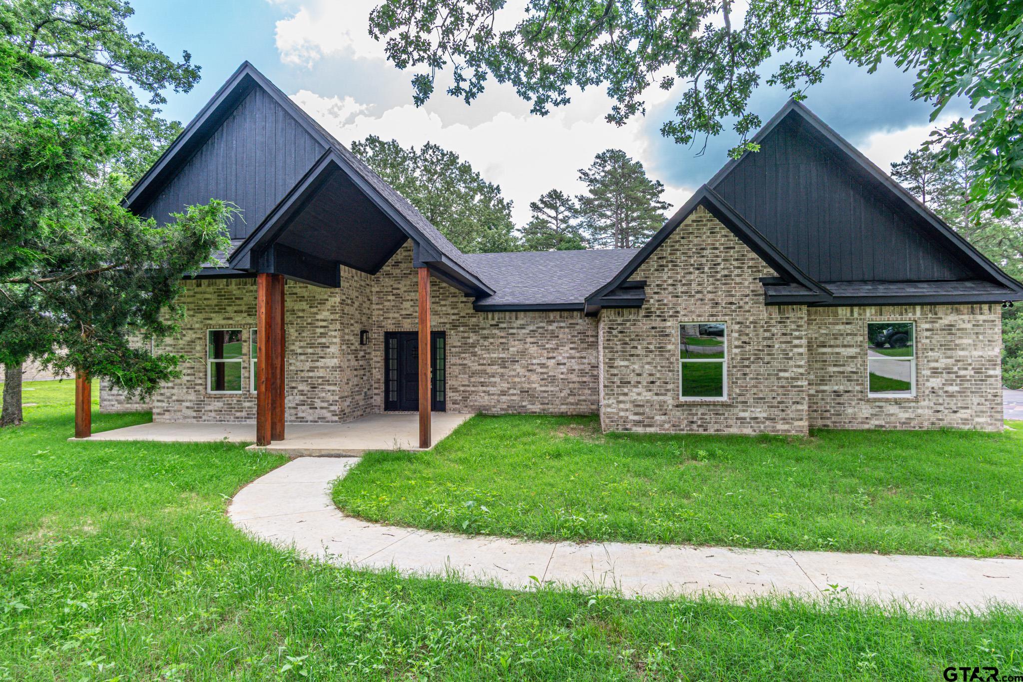 122 Pr 6305 Mineola Tx 75773 Mineola, TX 75773 - Photo 1 of 28 a front view of a house with a yard