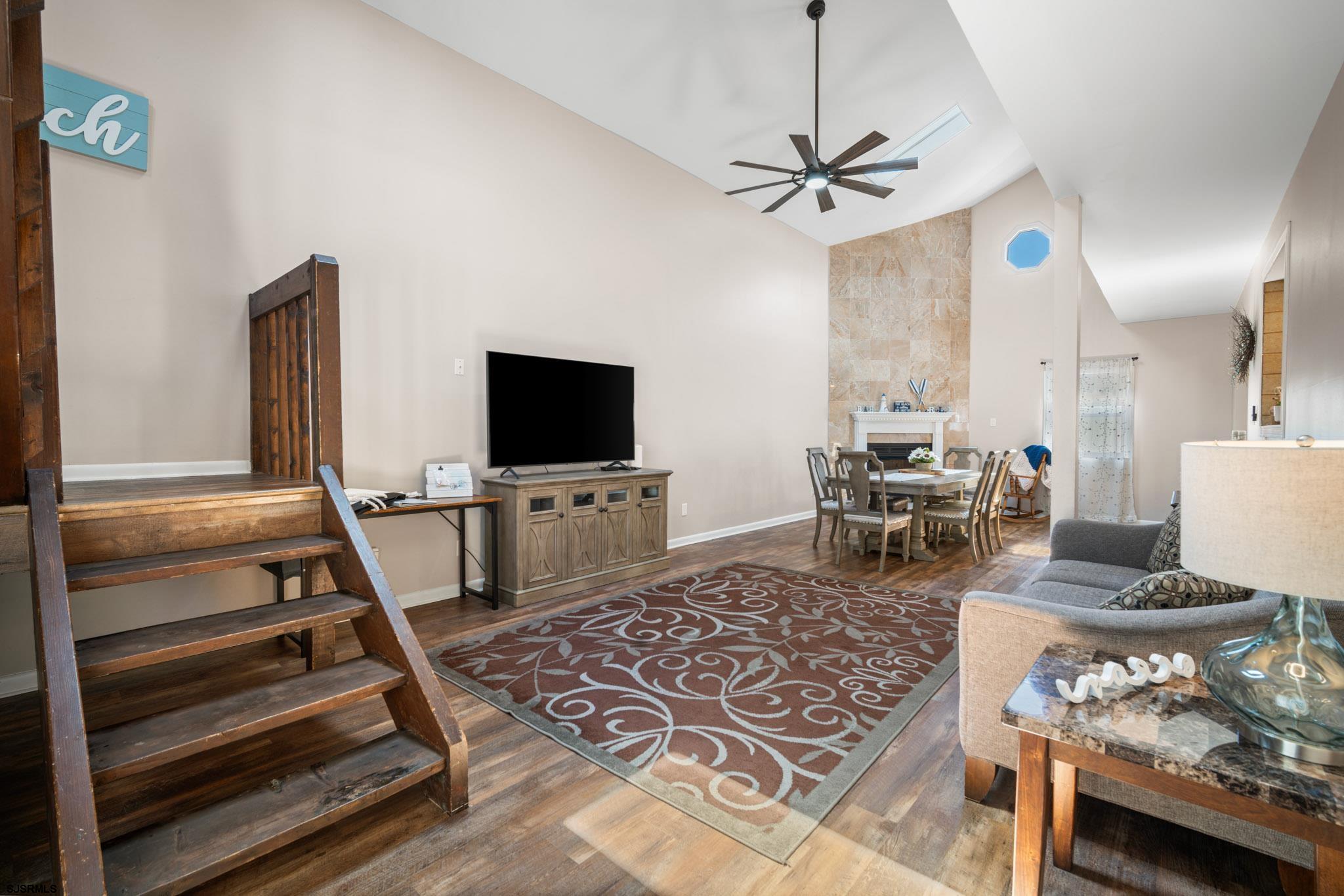 10 Explorer Road Brigantine, NJ 08203 - Photo 12 of 39 a living room with furniture and a flat screen tv