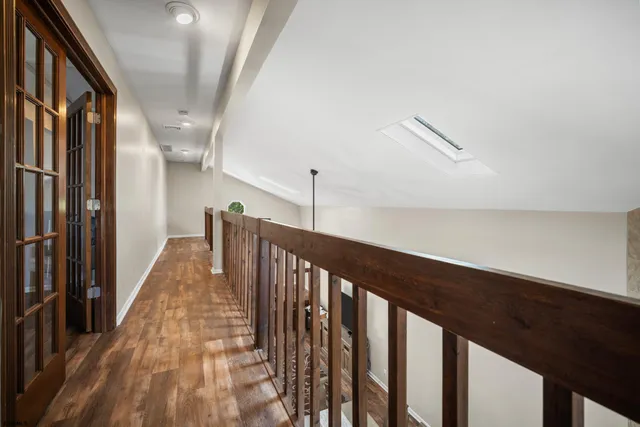 a bedroom with a bed and a tv on table