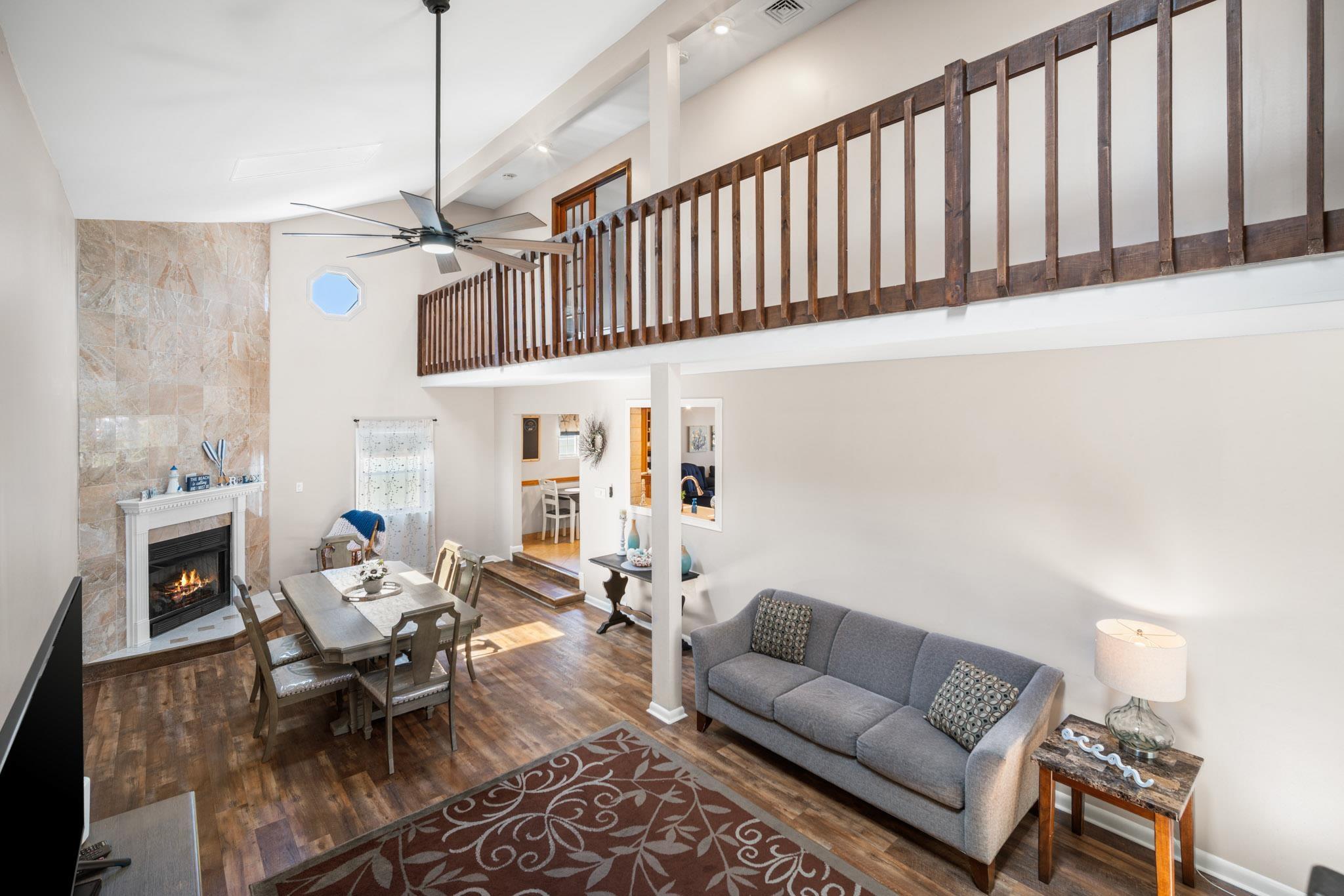 10 Explorer Road Brigantine, NJ 08203 - Photo 21 of 39 a living room with furniture wooden floor and a fireplace