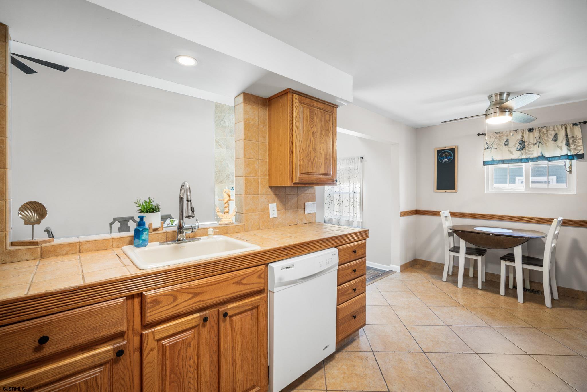10 Explorer Road Brigantine, NJ 08203 - Photo 22 of 39 a kitchen with a sink cabinets and window